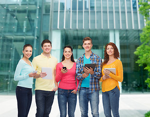 Image showing group of teenagers with smartphones and tablet pc