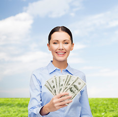 Image showing businesswoman with dollar cash money