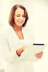 Image showing businesswoman with tablet pc in office