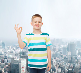 Image showing little boy in casual clothes making ok gesture