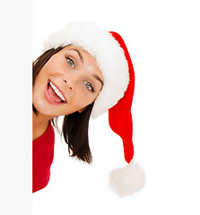 Image showing woman in santa helper hat with blank white board