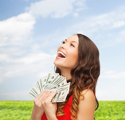 Image showing woman in red dress with us dollar money