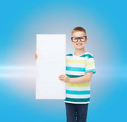 Image showing smiling boy in eyeglasses with white blank board