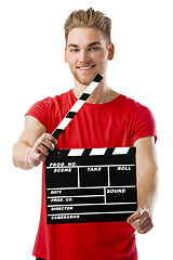 Image showing Holding a clapboard