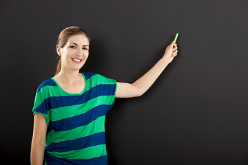 Image showing Writing on a chalkboard