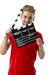 Image showing Holding a clapboard