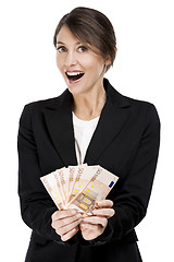 Image showing Woman holding euro currency notes
