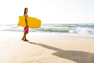 Image showing Girl with her bodyboard