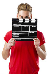 Image showing Holding a clapboard