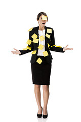 Image showing Business woman with yellow paper notes