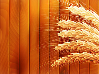 Image showing Wheat on wooden autumn background. EPS 10