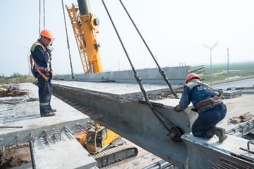 Image showing Engineer with radio controls equalization of span