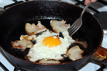 Image showing Fried egg during cooking