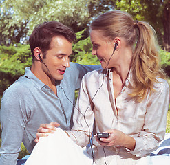 Image showing couple listening player 