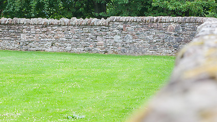 Image showing Stone wall in amongst agricultural scenery