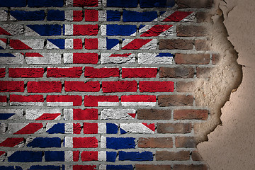 Image showing Dark brick wall with plaster - United Kingdom