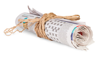 Image showing Roll Of Newspapers Tied With A Rope