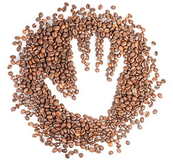 Image showing Hand Silhouette On Coffee Grains