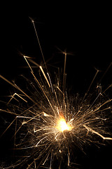 Image showing Burning sparklers on black background