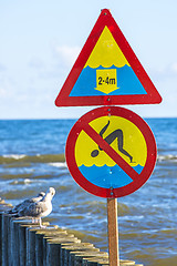 Image showing Groin in the Baltic Sea with danger sign