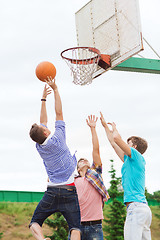 Image showing group of teenagers playing basketball