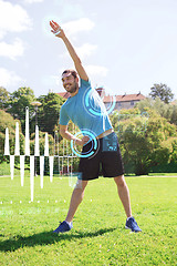 Image showing smiling man stretching outdoors