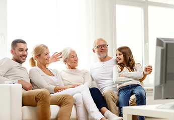 Image showing happy family watching tv at home