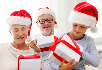 Image showing happy family sitting on couch at home