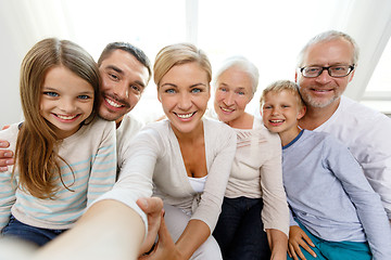 Image showing happy family making selfie at home