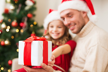 Image showing close up of father and daughter with gift box