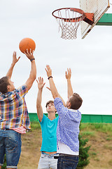 Image showing group of teenagers playing basketball