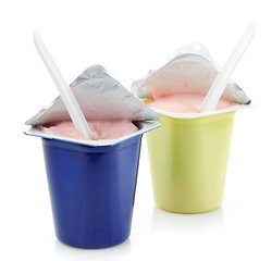 Image showing two plastic yogurt pots