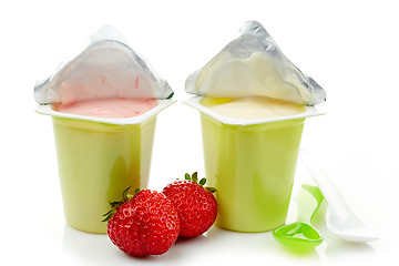 Image showing two plastic yogurt pots