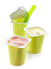 Image showing three plastic yogurt pots