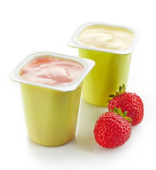 Image showing two plastic yogurt pots