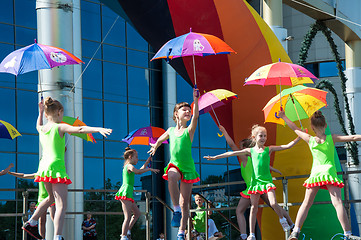 Image showing The girls performed a dance with umbrellas