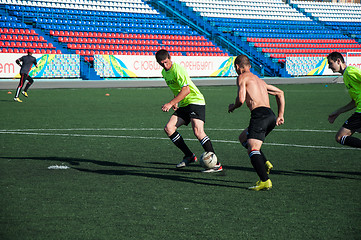 Image showing Boys play football