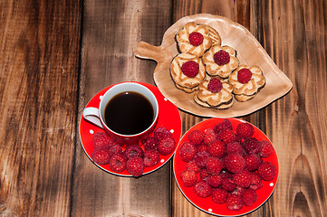 Image showing Ripe raspberry and coffee cup, 