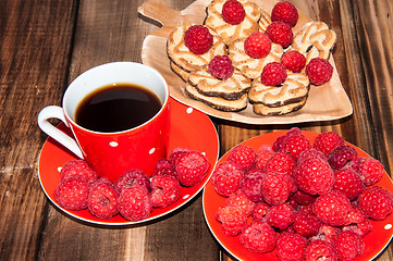 Image showing Ripe raspberry and coffee cup, 