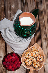 Image showing Ripe raspberry and milk jug 