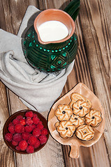 Image showing Ripe raspberry and milk jug 