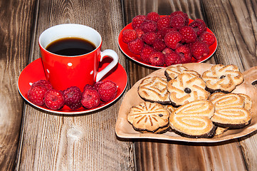 Image showing Ripe raspberry coffee cup and cookies 