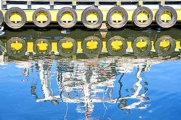 Image showing reflection of a boat in a port