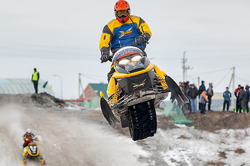 Image showing Jump of sportsman on snowmobile