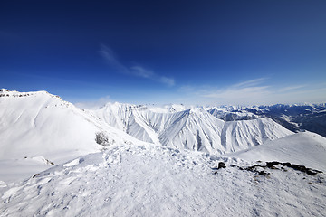 Image showing Winter snowy mountains and blue sky