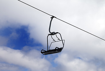 Image showing Chair-lift and cloudy sky