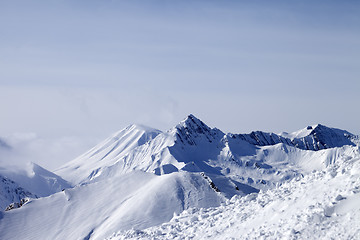 Image showing View from off-piste slope at mountains in fog