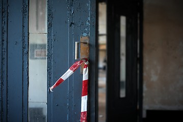 Image showing Blue grungy door at a factory