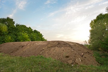 Image showing Large pile of soil under blue sky