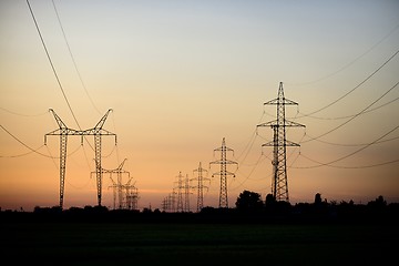 Image showing Large transmission towers at sunset